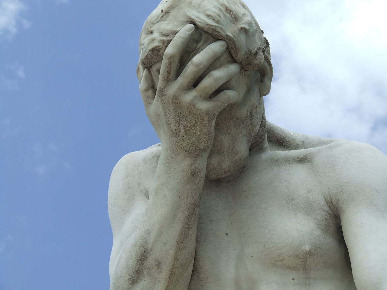 statue with disappointed look on its face